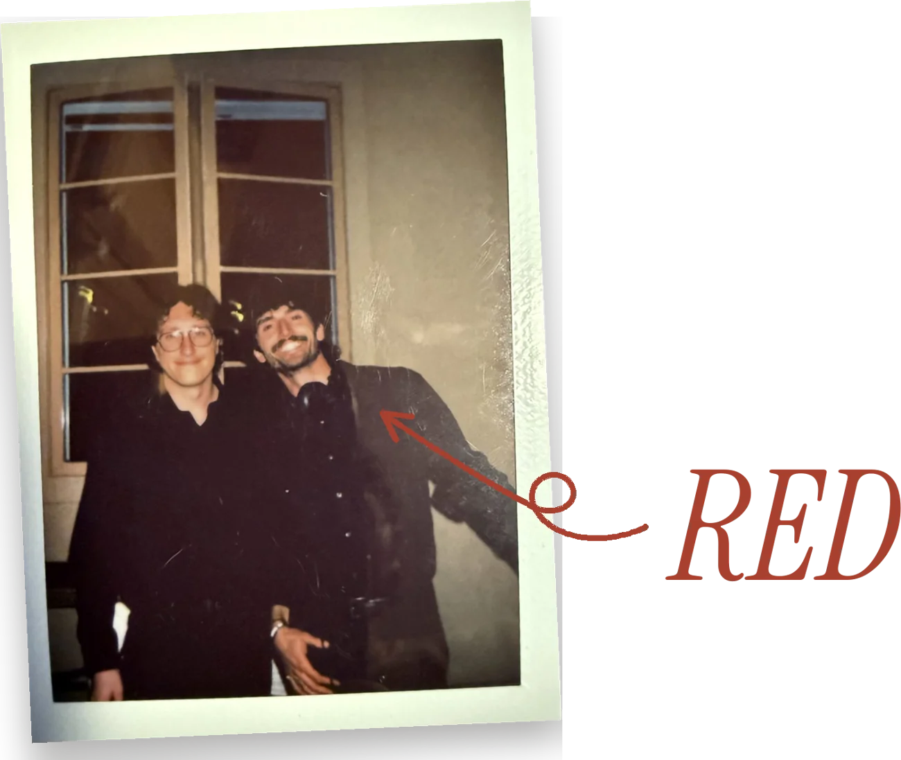 A Polaroid photo of Ryan and Danny, with a looping arrow from the word RED pointing at them
